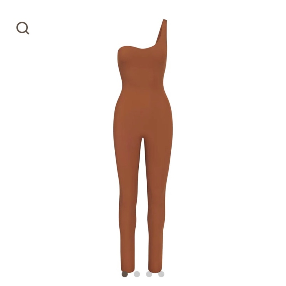 Skims one-shoulder bodysuit. Tags removed but never worn. Size XS